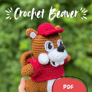 May include: A white ceramic mug with a black handle and the text "But First, Coffee" in a black, bold font. The mug is on a white surface.