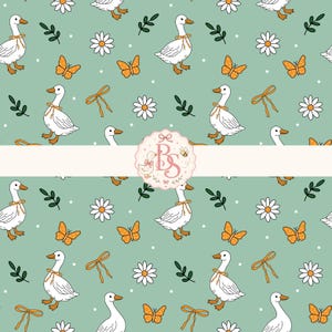 May include: A seamless pattern on a sage green background featuring white geese with orange beaks and feet, wearing thin orange ribbons around their necks. The design includes white daisies, orange butterflies, green sprigs, and small white dots.