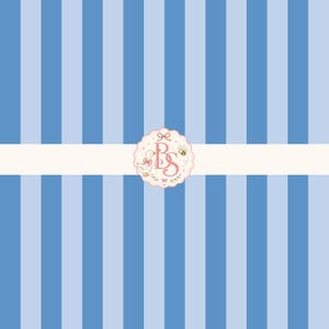 May include: A pattern of vertical stripes in alternating shades of light and medium blue. A horizontal white band crosses the center, featuring a scalloped circular logo with the letters BS, a small duck, a bee, and floral accents.