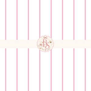 May include: A white background featuring vertical pink stripes and a central circular emblem. The emblem displays the letters BS in a decorative font, accompanied by a small illustration of a duck and a bee, all framed by a scalloped border.