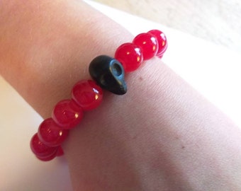 Red Skull Stretch Bracelet. Carved Black Obsidian Skull with Cherry Red Beads