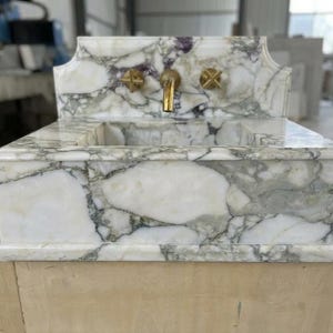Handcarved Calacatta Monet marble wall mounted sink by Marblyart, custom made to order — photo 7 of 11