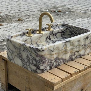 Handcarved Calacatta Viola marble wall mounted sink by Marblyart, custom made to order — photo 9 of 15
