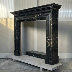 Handcarved Nero Marquina marble fireplace mantel by Marblyart, custom made to order — photo 4 of 11