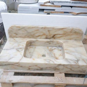 Handcarved Calacatta Gold marble floating vanity sink by Marblyart, custom made to order — photo 8 of 14