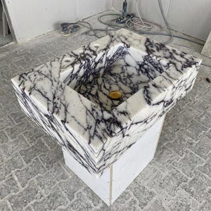 Calacatta Viola Marble wall mount sink — isometric three-quarter view (photo 9)