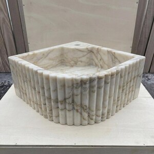 Calacatta Gold Marble fluted vessel sink — front view (photo 2)
