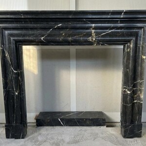 Handcarved Nero Marquina marble fireplace mantel by Marblyart, custom made to order — photo 11 of 11