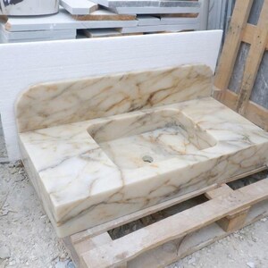 Handcarved Calacatta Gold marble floating vanity sink by Marblyart, custom made to order — photo 12 of 14