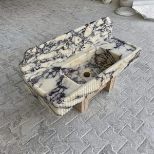 Calacatta Viola Marble fluted vessel sink — isometric three-quarter view (photo 9)