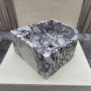 Calacatta Viola Marble fluted vessel sink — isometric three-quarter view (photo 9)