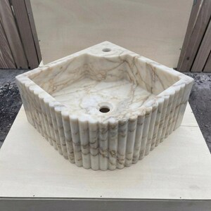 Calacatta Gold Marble fluted vessel sink — isometric three-quarter view (photo 6)