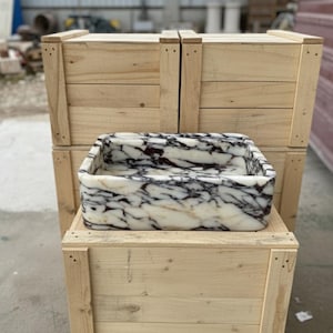 Handcarved Calacatta Viola marble wall mounted sink by Marblyart, custom made to order — photo 10 of 11