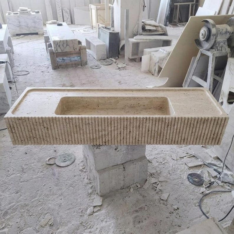 Beige Travertine fluted vessel sink — eye-level view (photo 17)