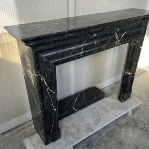 Handcarved Nero Marquina marble fireplace mantel by Marblyart, custom made to order — photo 7 of 11