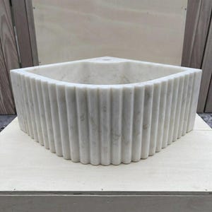 Handcarved Carrara marble fluted vessel sink by Marblyart, custom made to order — photo 3 of 13
