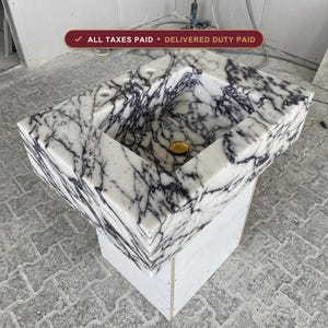 Handcarved Calacatta Viola marble wall mounted sink by Marblyart, custom made to order — photo 1 of 11