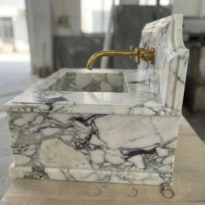 Handcarved Calacatta Monet marble wall mounted sink by Marblyart, custom made to order — photo 4 of 11