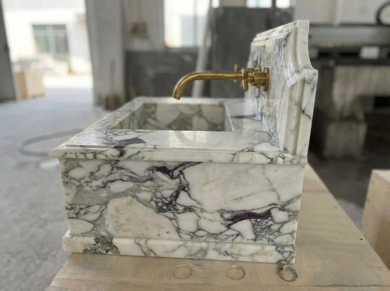 Handcarved Calacatta Monet marble wall mounted sink by Marblyart, custom made to order — photo 4 of 11