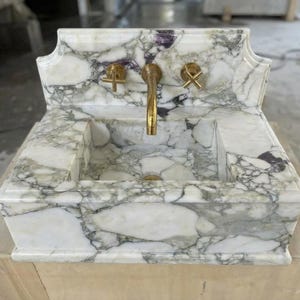 Handcarved Calacatta Monet marble wall mounted sink by Marblyart, custom made to order — photo 6 of 11