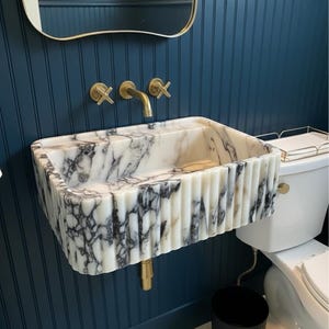 Handcarved Calacatta Viola marble wall mounted sink by Marblyart, custom made to order — photo 2 of 11