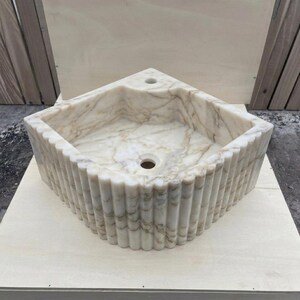 Calacatta Gold Marble fluted vessel sink — front view (photo 9)