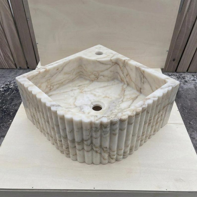 Calacatta Gold Marble fluted vessel sink — front view (photo 9)