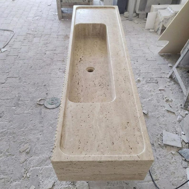 Beige Travertine fluted vessel sink — top-down view (photo 4)