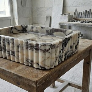 Handcarved Calacatta Viola marble vessel sink by Marblyart, custom made to order — photo 13 of 15