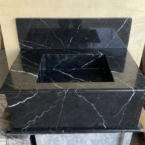 Handcarved Nero Marquina marble wall mounted sink by Marblyart, custom made to order — photo 10 of 13