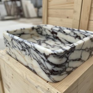 Handcarved Calacatta Viola marble wall mounted sink by Marblyart, custom made to order — photo 4 of 11