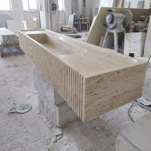 Beige Travertine fluted vessel sink — right side view (photo 3)