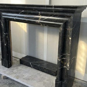 Handcarved Nero Marquina marble fireplace mantel by Marblyart, custom made to order — photo 8 of 11