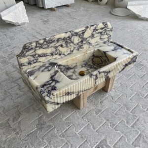 Calacatta Viola Marble fluted vessel sink — isometric three-quarter view (photo 8)