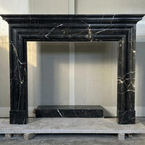 Handcarved Nero Marquina marble fireplace mantel by Marblyart, custom made to order — photo 2 of 11
