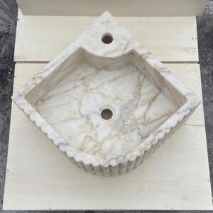 Calacatta Gold Marble fluted vessel sink — top-down view (photo 5)