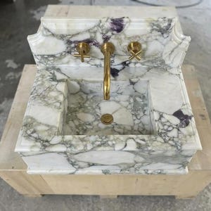 Handcarved Calacatta Monet marble wall mounted sink by Marblyart, custom made to order — photo 5 of 11