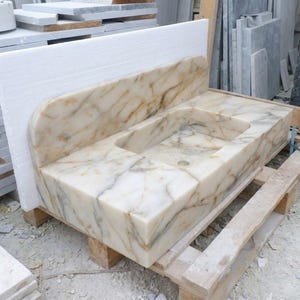 Handcarved Calacatta Gold marble floating vanity sink by Marblyart, custom made to order — photo 9 of 14