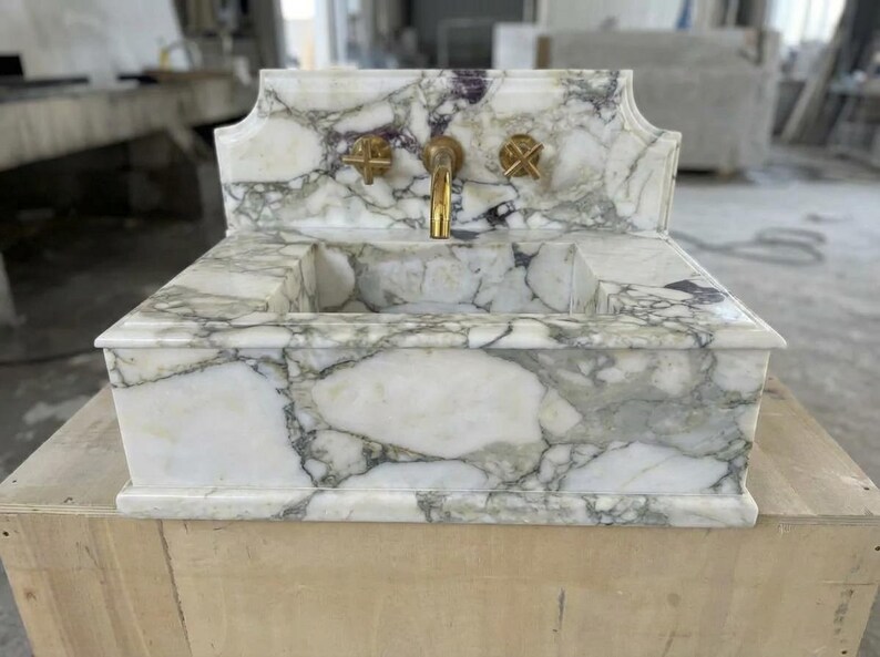 Handcarved Calacatta Monet marble wall mounted sink by Marblyart, custom made to order — photo 3 of 11