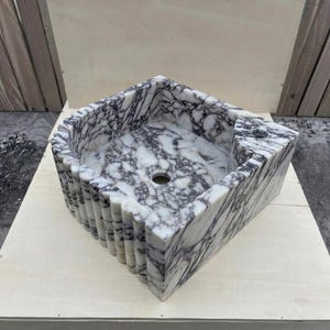 Calacatta Viola Marble fluted vessel sink — isometric three-quarter view (photo 6)