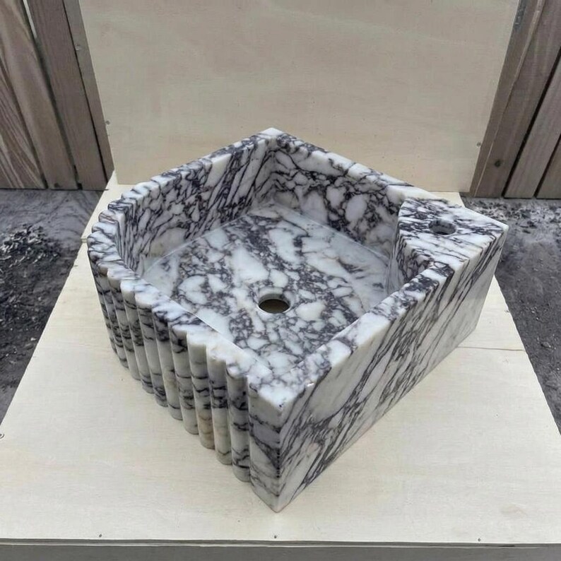 Calacatta Viola Marble fluted vessel sink — isometric three-quarter view (photo 6)