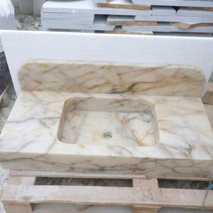 Handcarved Calacatta Gold marble floating vanity sink by Marblyart, custom made to order — photo 13 of 14