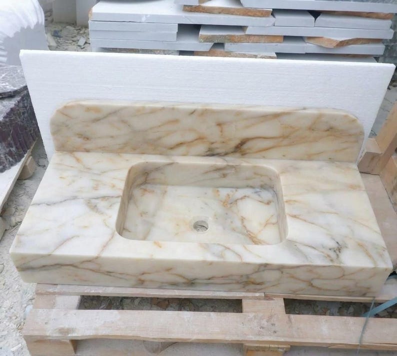 Handcarved Calacatta Gold marble floating vanity sink by Marblyart, custom made to order — photo 13 of 14