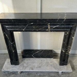 Handcarved Nero Marquina marble fireplace mantel by Marblyart, custom made to order — photo 6 of 11