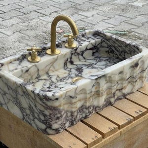 Handcarved Calacatta Viola marble wall mounted sink by Marblyart, custom made to order — photo 13 of 15