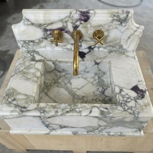 Handcarved Calacatta Monet marble wall mounted sink by Marblyart, custom made to order — photo 9 of 11