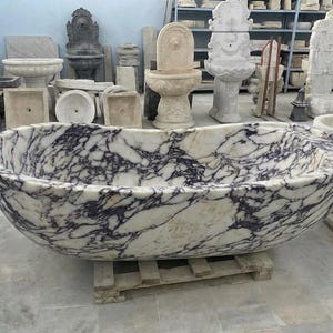 Handcarved Calacatta Viola marble freestanding bathtub by Marblyart, custom made to order — photo 1 of 13