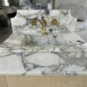 Handcarved Calacatta Monet marble wall mounted sink by Marblyart, custom made to order — photo 10 of 11
