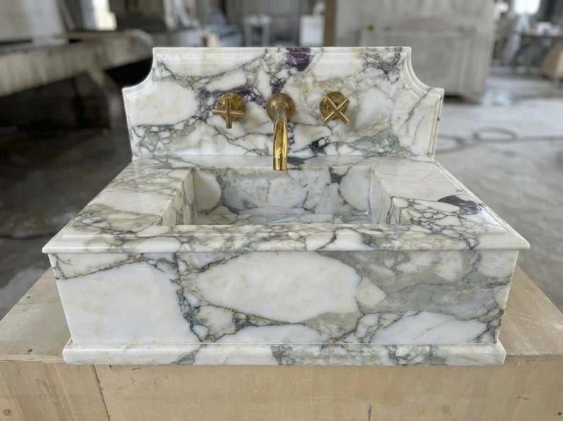 Handcarved Calacatta Monet marble wall mounted sink by Marblyart, custom made to order — photo 10 of 11