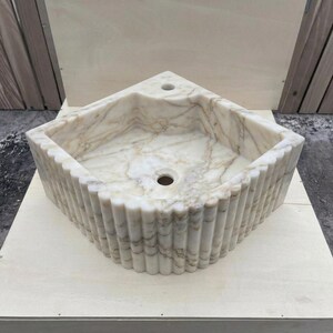 Calacatta Gold Marble fluted vessel sink — eye-level view (photo 18)